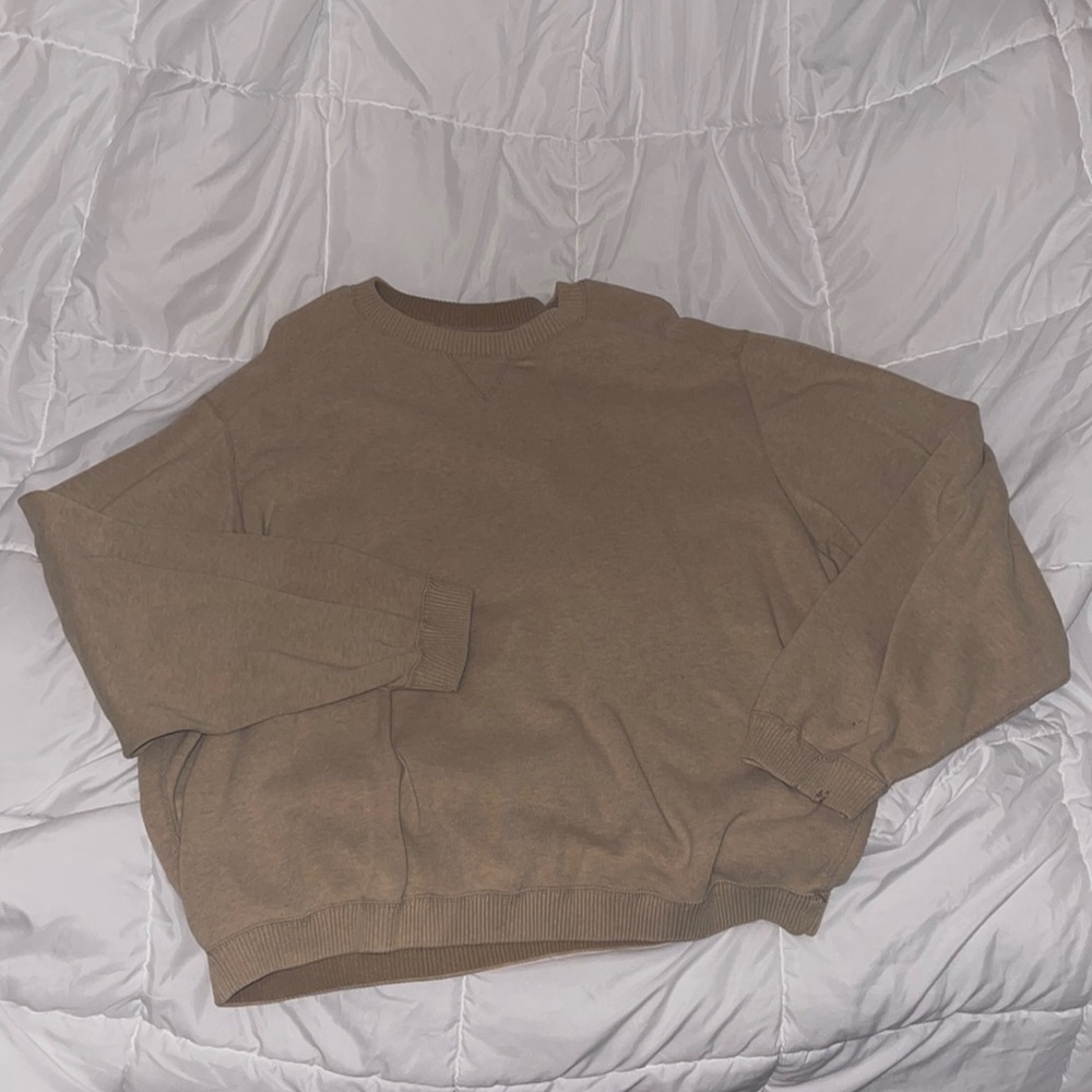 Tan/light brown sweater with small hole on sleeve
